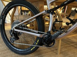 A SRAM XX SL Transmission Drivetrain with Quarq Power Meter mounted on a Silver MTB.