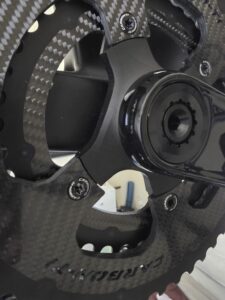 A photo of Carbon-Ti X-CarboRing EVO 110x4 Road Chainrings installed on a crankset
