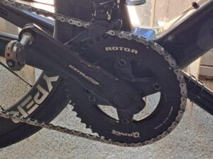 A black ROTOR 2INpower SL power meter crankset installed on a bike.