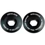 A pair of black SRM Origin Crank Caps against a white background.