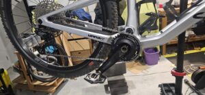 An XCADEY power meter installed on a Shimano Deore MTB crankset.