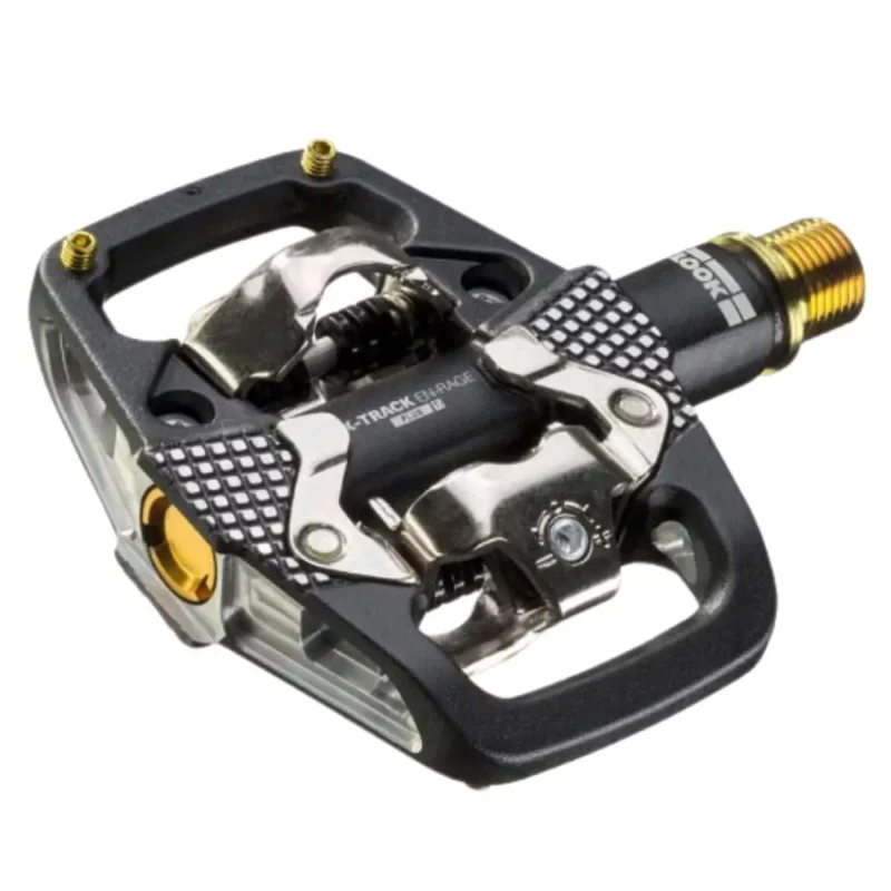 A black and silver LOOK X-TRACK EN-RAGE PLUS TI MTB Pedal with gold accents.