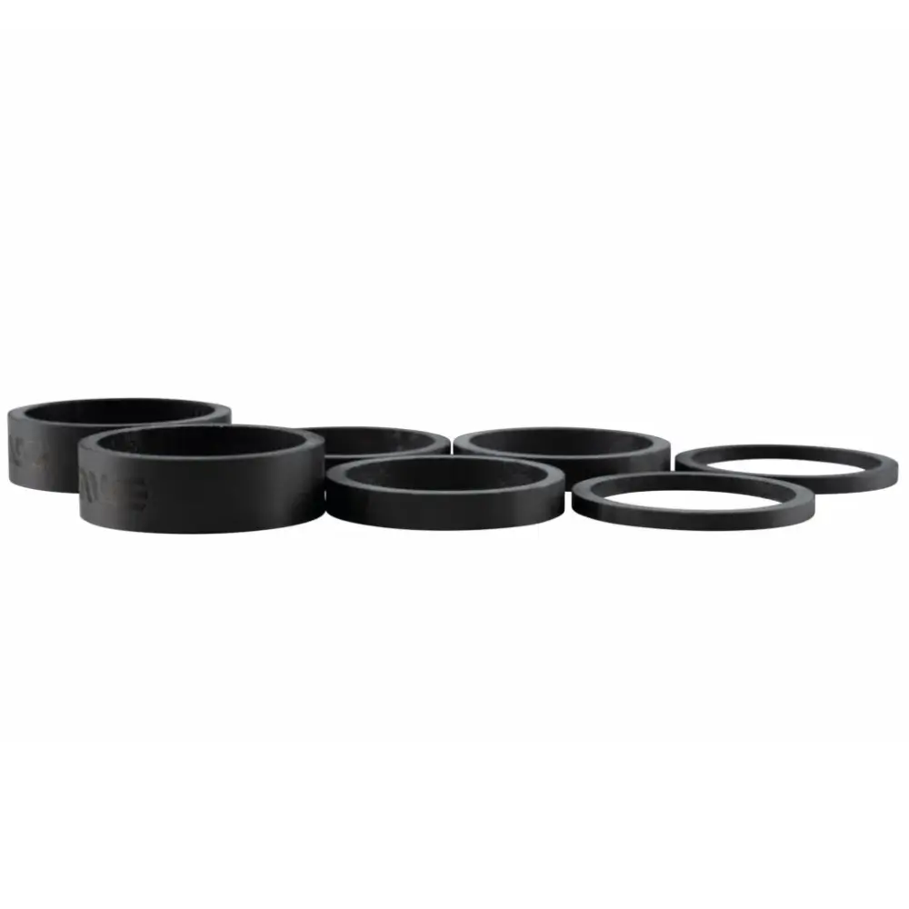 Different sizes of black ENVE Carbon Headset Spacers for the entire kit.