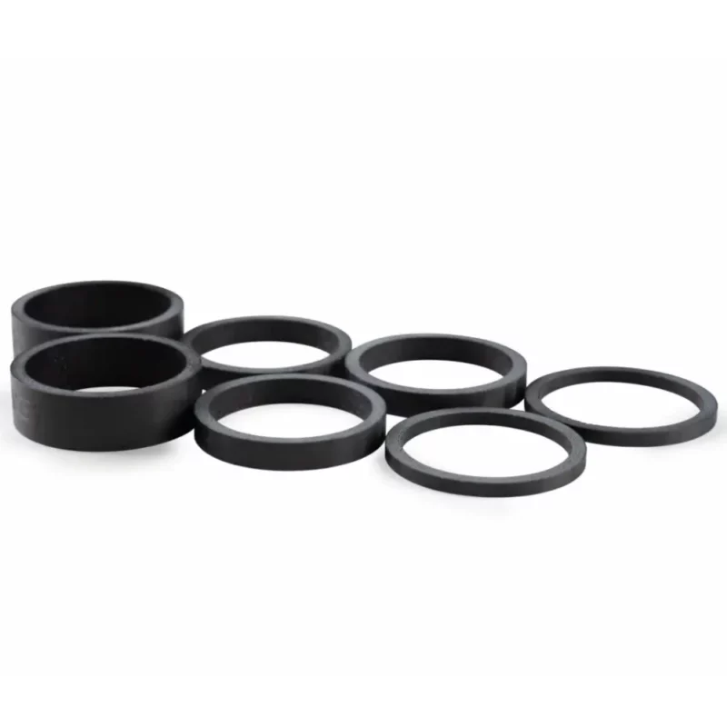 A set of black ENVE Carbon Headset Spacers to make a complete kit.