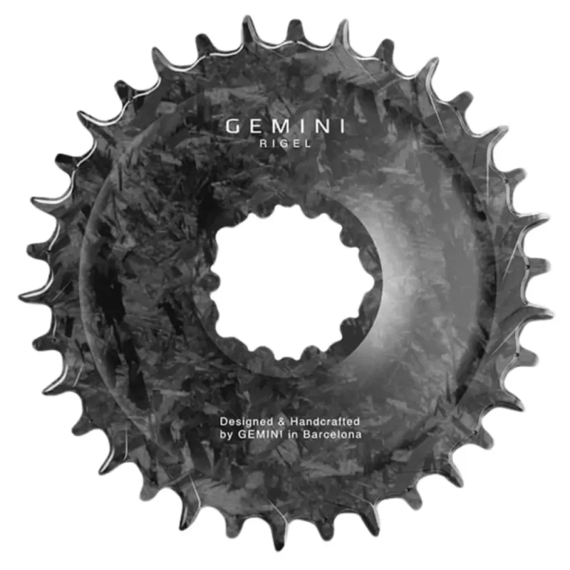 The front of a Gemini Rigel 3-Bolt MTB Chainring that shows the carbon weave.