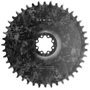 The front of a Gemini Rigel 8-Bolt Road Gravel Chainring that shows the carbon weave.