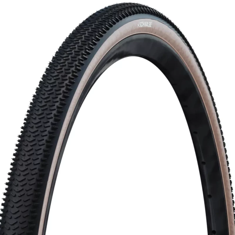 A close up of the tread on a Schwalbe G-One R Gravel Tire with tan sidewall.