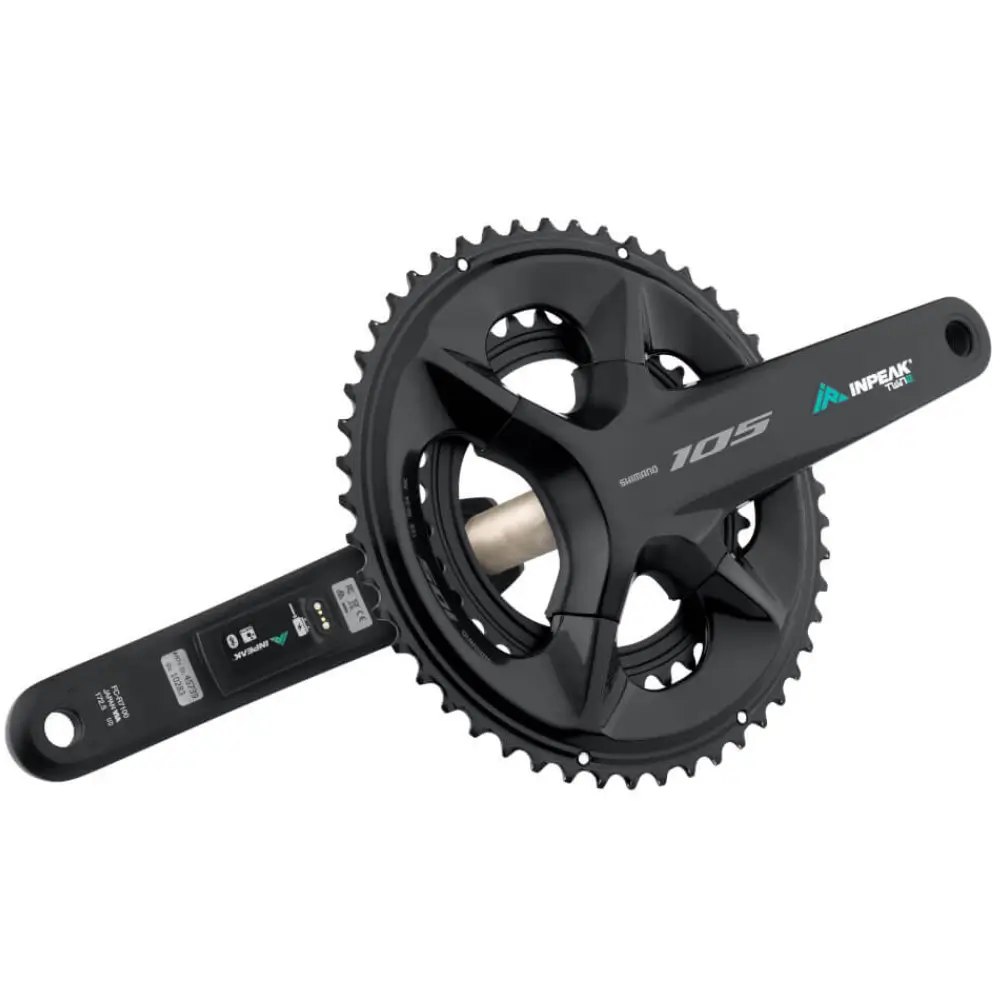 A black Shimano 105 R7100 crankset featuring INPEAK-POWERCRANK-E-TWiN2 sensors installed, with a teal and white INPEAK decal on the drive side crank arm.