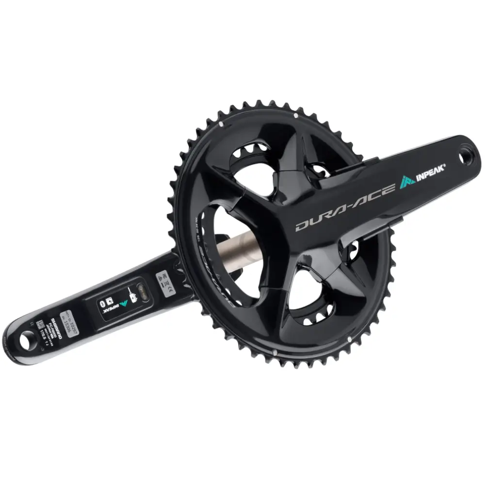A black Shimano Dura Ace R9200 crankset featuring INPEAK-POWERCRANK-E-TWiN2 sensors installed, with a teal and white INPEAK decal on the drive side crank arm.