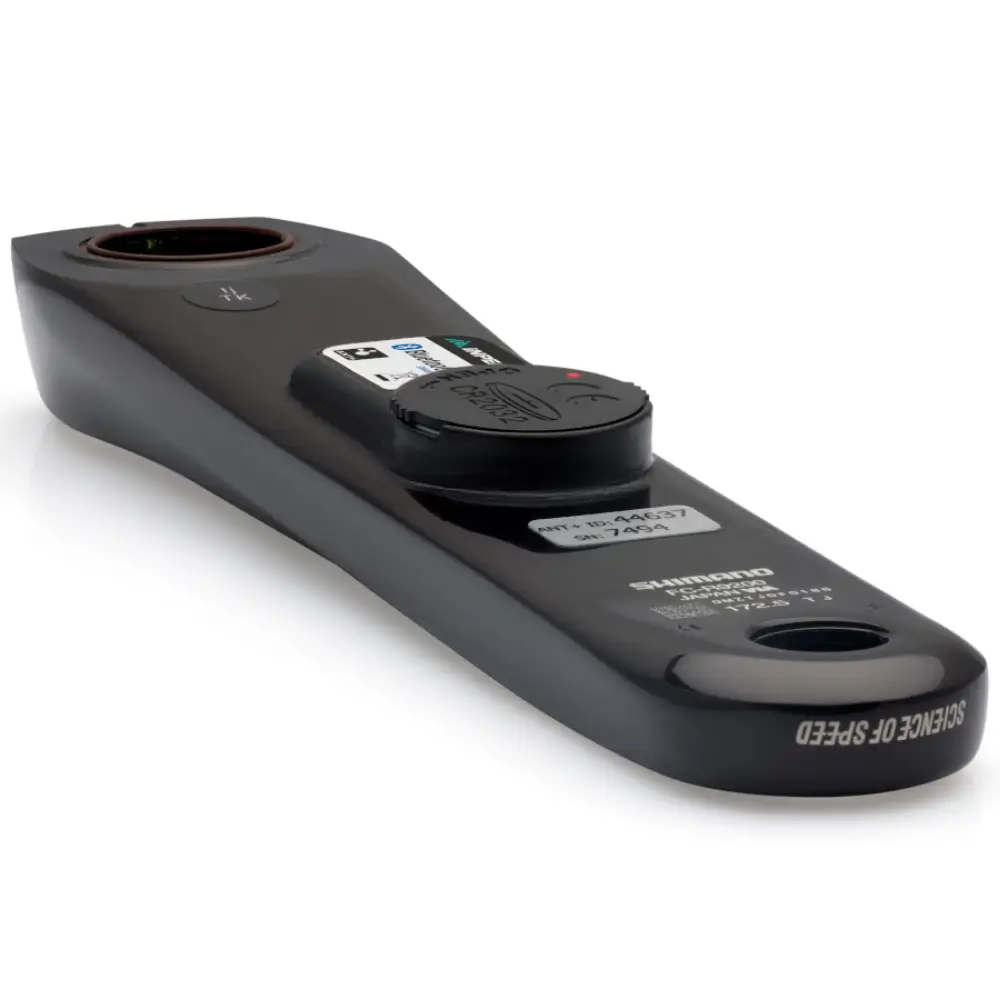 A black Shimano R9200 crank arm with an INPEAK POWERCRANK power meter sensor installed.