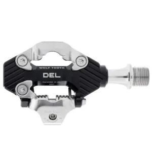 A top view of a black Wolf Tooth DEL MTB/Gravel Pedal