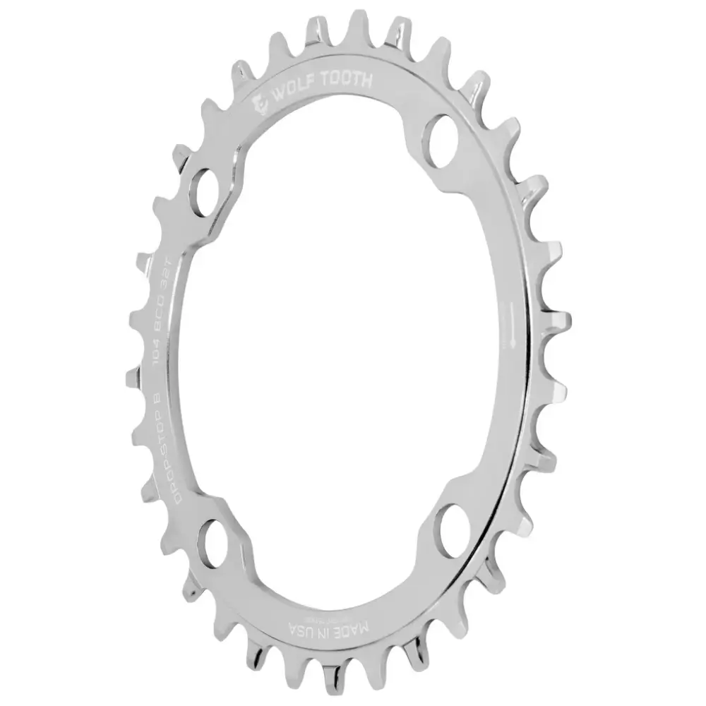 A Wolf Tooth Components 1x 104 BCD MTB Chainring in Raw Silver viewed at an oblique angle