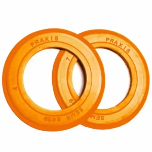 An orange Praxis 24MM Bottom Bracket Seal Kit