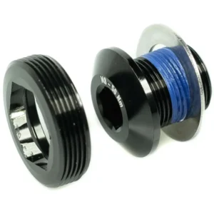 A black Praxis M24 Crank Bolt and Self-Extracting Cap