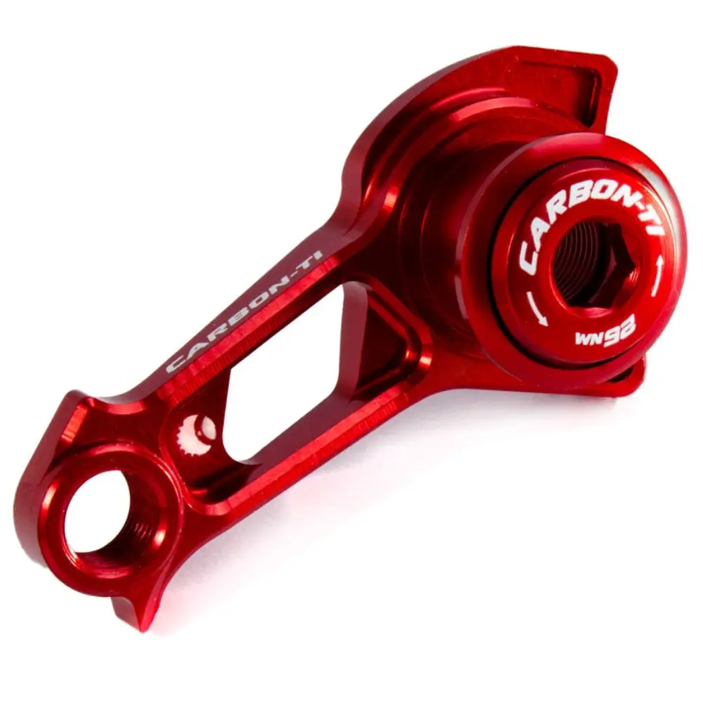A red Carbon-Ti X-Hanger Shimano DM Derailleur Hanger viewed at an angle