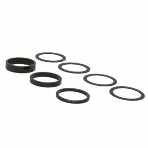 A black Wolf Tooth DUB Bottom Bracket Spacer Kit including 7 spacers