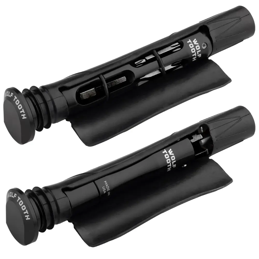 An angled view of the tools of the Wolf Tooth EnCase Bar Kit One Tool System inside the carrying sleeves.