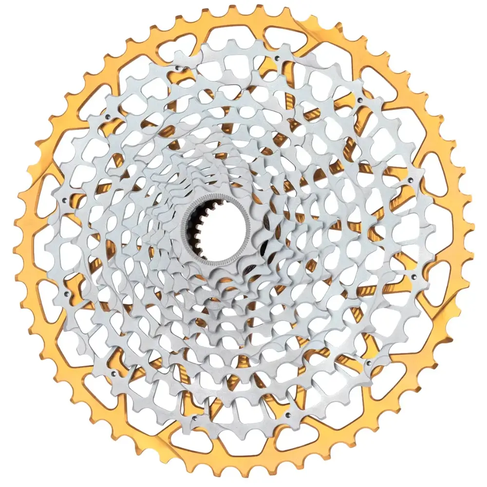 A mostly silver Garbaruk Shimano Micro Spline GEN2.0 12-Speed MTB Cassette with a gold largest cog