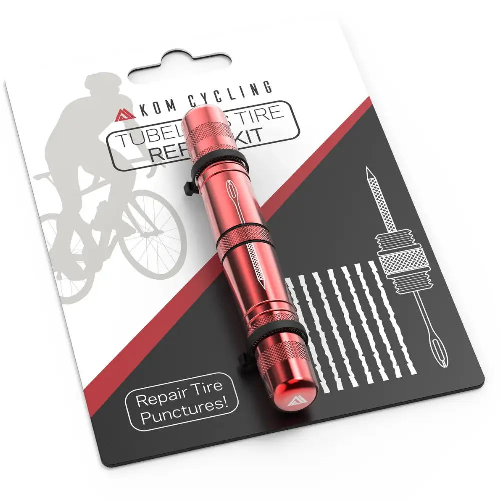 A red KOM Cycling Tubeless Tire Repair Tool