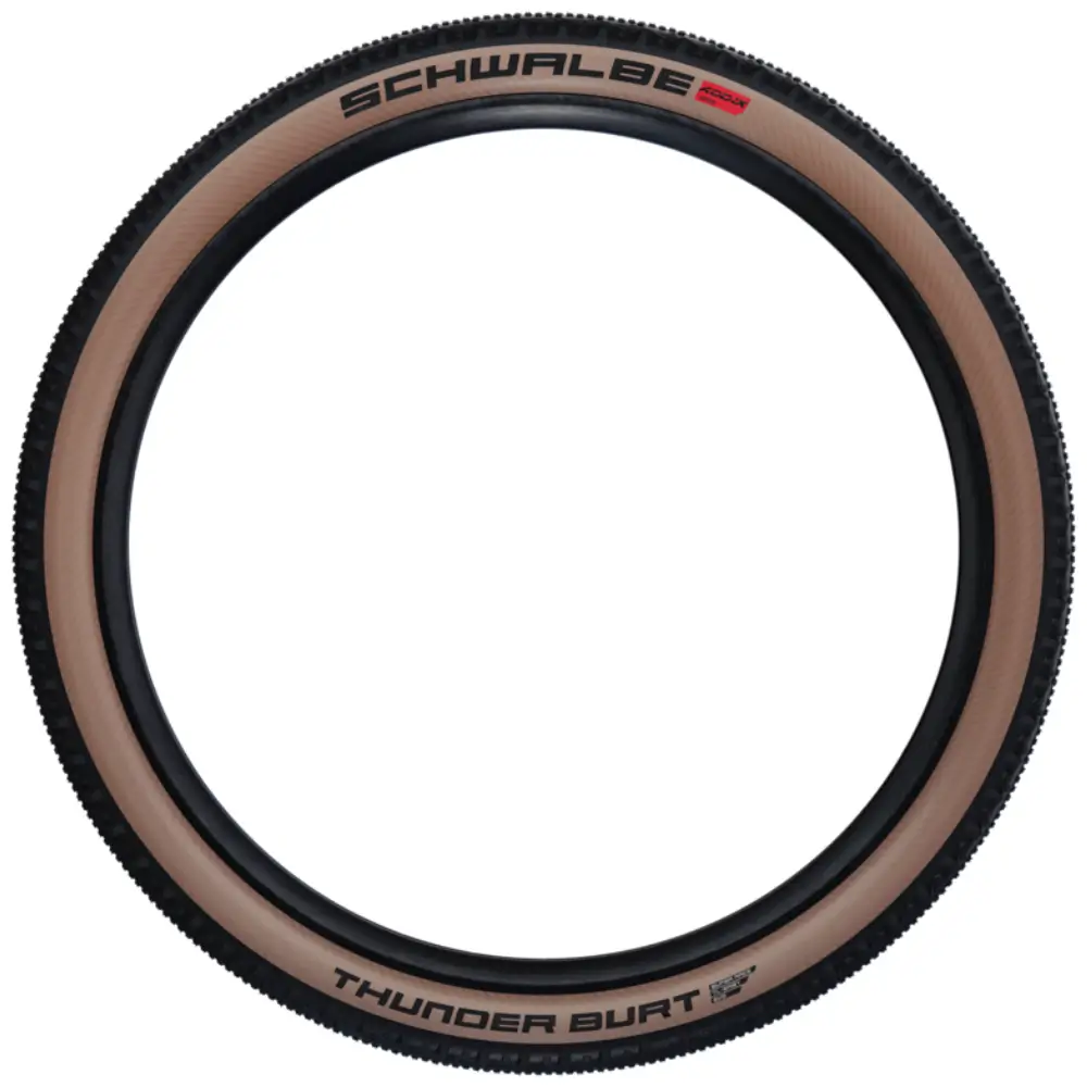 An image of the full tire of a Schwalbe Thunder Burt MTB/Gravel Tire with transparent sidewalls