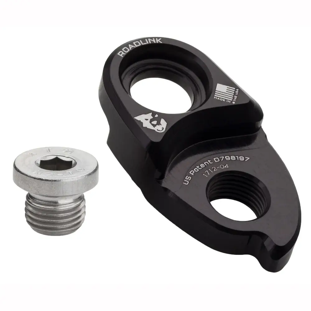 A black Wolf Tooth Road Link on a white background with mounting bolt removed