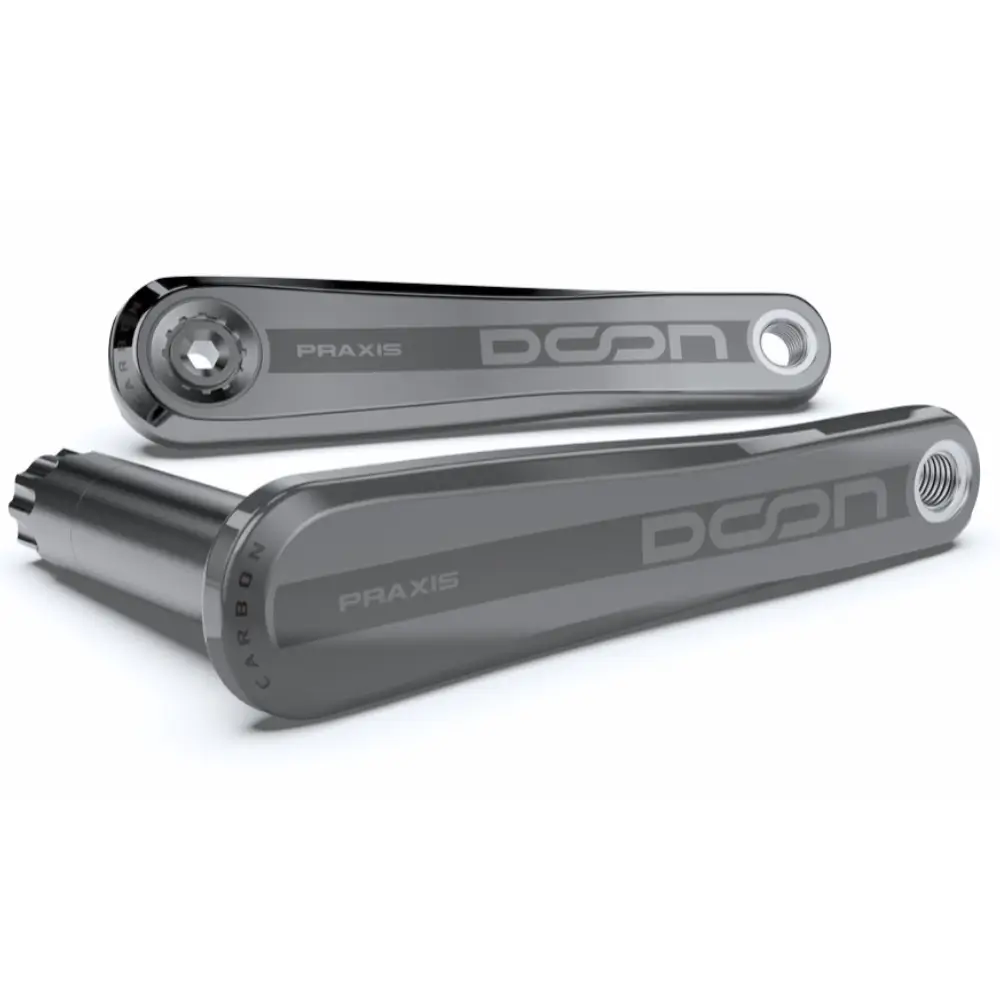 A pair of Praxis Works DOON Carbon-GR Gravel Crank Arms viewed from a low angle on a white background